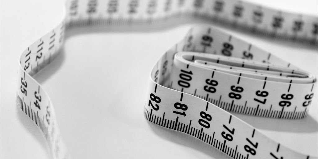 selective focus photography of tape measure