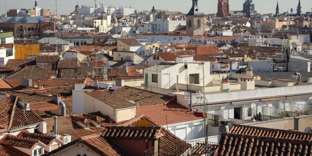 a view of a city with rooftops and tall buildings